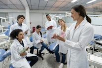 A female junior research group leader with her team